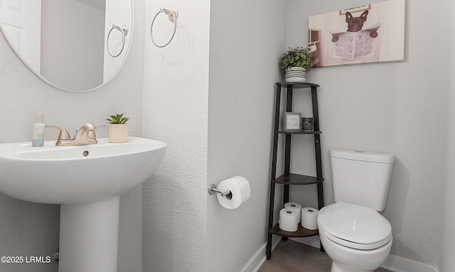 bathroom featuring sink and toilet