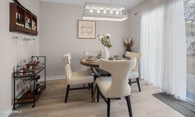 dining space with light wood-type flooring