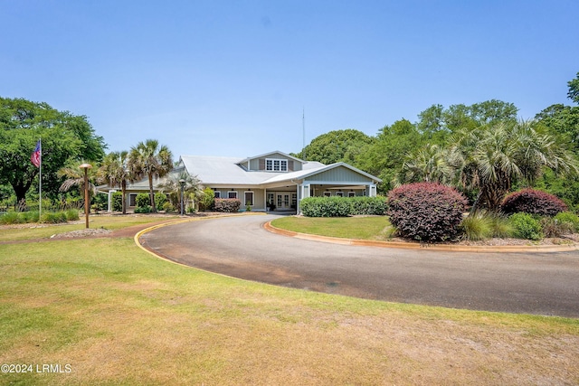 100 Thomas Sumter St, Beaufort, SC 29907 - view of front of property with a front yard, curved driveway, and french doors