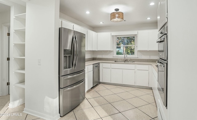 100 Thomas Sumter St, Beaufort, SC 29907 - kitchen featuring stainless steel appliances, light countertops, light tile patterned flooring, white cabinets, and recessed lighting