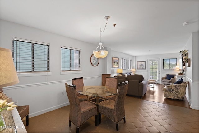 663 William Hilton Pkwy Unit 3321, Hilton Head Island, SC 29928 - dining space with tile patterned floors, baseboards, and a chandelier