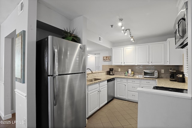 663 William Hilton Pkwy Unit 3321, Hilton Head Island, SC 29928 - kitchen with stainless steel appliances, a sink, decorative backsplash, white cabinetry, and light tile patterned floors
