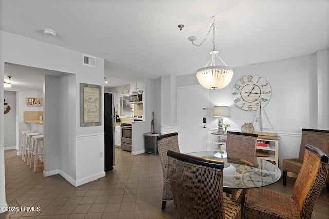 663 William Hilton Pkwy Unit 3321, Hilton Head Island, SC 29928 - dining room with tile patterned floors, baseboards, and a chandelier