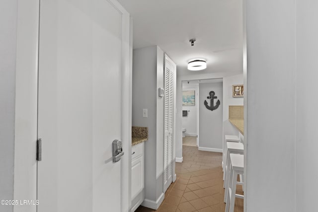 663 William Hilton Pkwy Unit 3321, Hilton Head Island, SC 29928 - hall with tile patterned flooring and baseboards