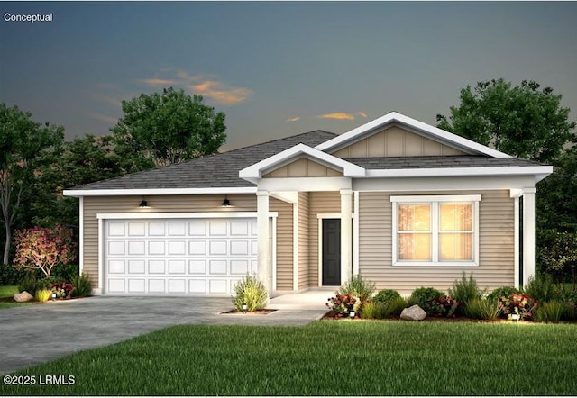 view of front facade featuring a garage and a yard