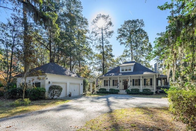 view of front facade featuring a porch and a garage