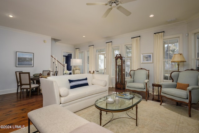 living room with ceiling fan, ornamental molding, and hardwood / wood-style floors