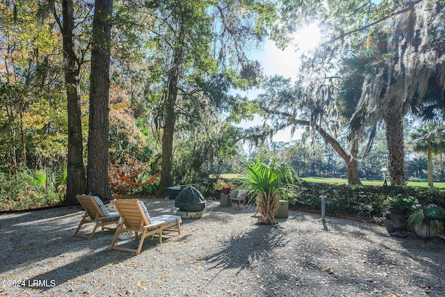 view of yard with a fire pit