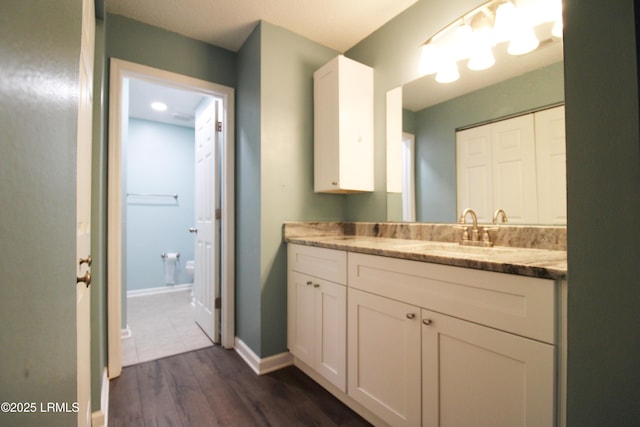 18 Old S Ct Unit 18A, Bluffton, SC 29910 - bathroom featuring baseboards, wood finished floors, and vanity