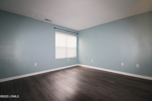 18 Old S Ct Unit 18A, Bluffton, SC 29910 - spare room with dark wood-style floors, visible vents, and baseboards