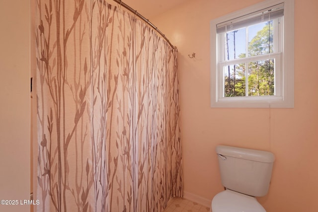 bathroom featuring tile patterned floors and toilet