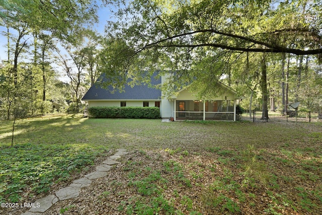 view of yard featuring a sunroom
