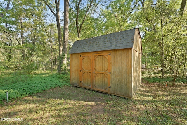 view of shed with fence