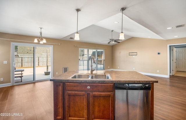 kitchen featuring a kitchen island with sink, dishwasher, sink, and light hardwood / wood-style flooring