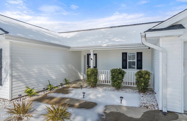 entrance to property with covered porch