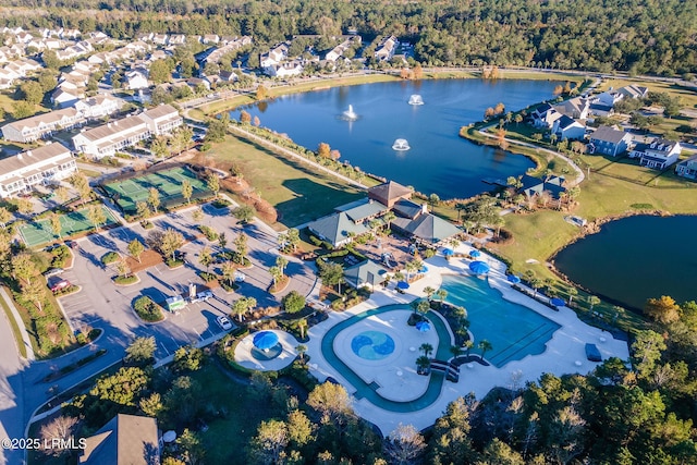 birds eye view of property with a water view