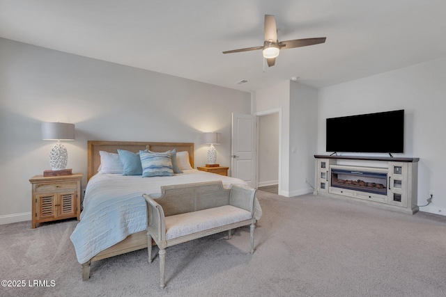 bedroom with a ceiling fan, carpet flooring, visible vents, and baseboards