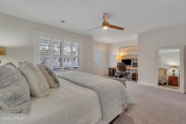 bedroom featuring a ceiling fan, carpet flooring, visible vents, and baseboards