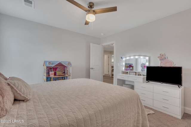 bedroom with light carpet, visible vents, and a ceiling fan