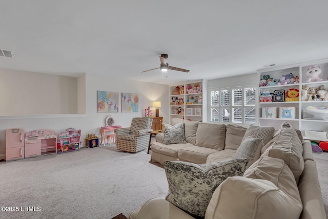 carpeted living room featuring ceiling fan and visible vents