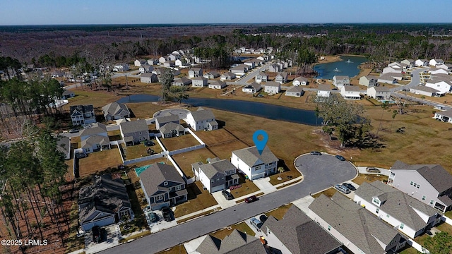 bird's eye view featuring a residential view and a water view