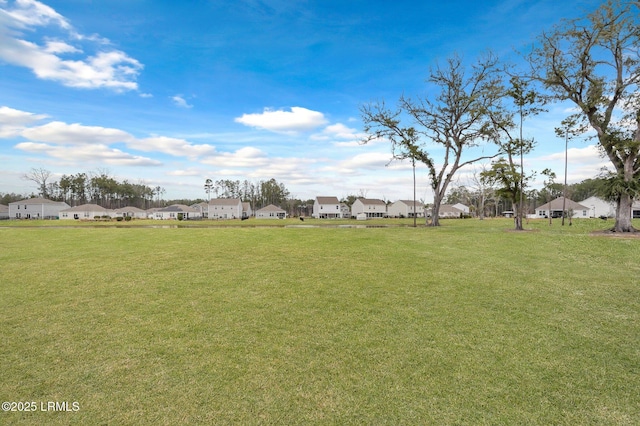 view of yard featuring a residential view