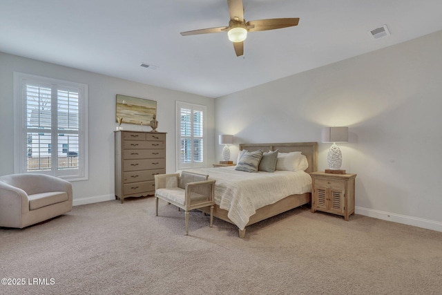 bedroom with carpet, visible vents, and baseboards