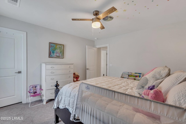 bedroom with carpet floors, visible vents, and a ceiling fan