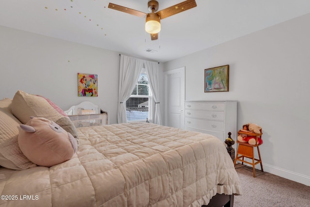 carpeted bedroom with a ceiling fan, visible vents, and baseboards