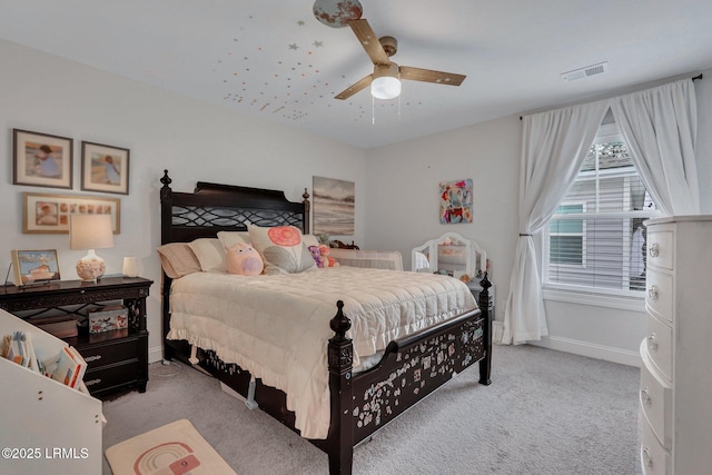 bedroom featuring ceiling fan, carpet floors, visible vents, and baseboards