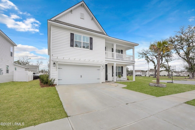 view of front of home featuring concrete driveway, an attached garage, board and batten siding, fence, and a front lawn