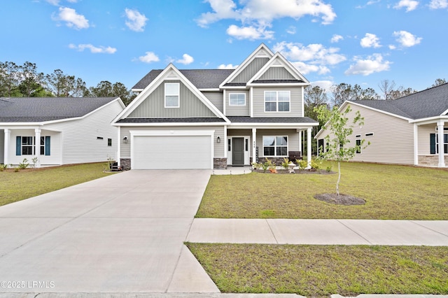 400 Ramport St, Ridgeland, SC 29936 - craftsman-style house with board and batten siding, covered porch, driveway, a garage, and a front lawn