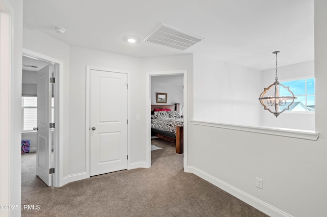 400 Ramport St, Ridgeland, SC 29936 - corridor with an inviting chandelier, plenty of natural light, carpet, and visible vents