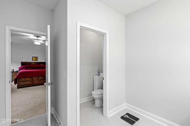 400 Ramport St, Ridgeland, SC 29936 - bathroom with baseboards, ceiling fan, tile patterned flooring, and toilet