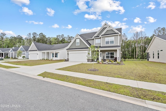 400 Ramport St, Ridgeland, SC 29936 - view of front of property with board and batten siding, concrete driveway, a shingled roof, and a front lawn