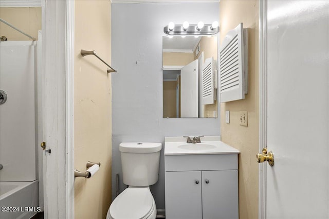 full bathroom featuring vanity, crown molding, bathing tub / shower combination, and toilet