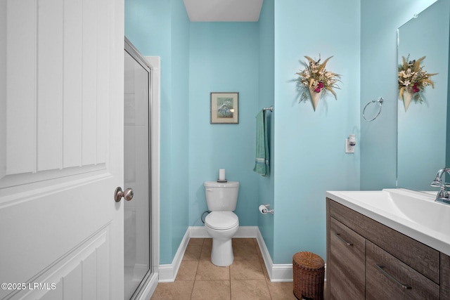 full bath with toilet, tile patterned floors, a shower stall, and vanity