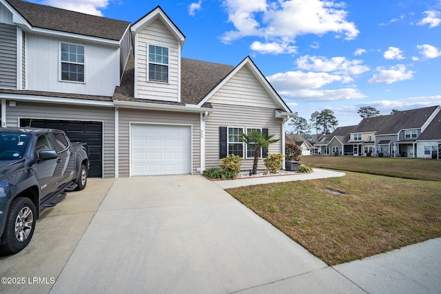 view of front of house with roof with shingles, concrete driveway, an attached garage, a residential view, and a front lawn