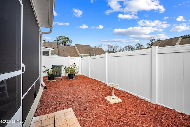 view of yard featuring cooling unit and a fenced backyard