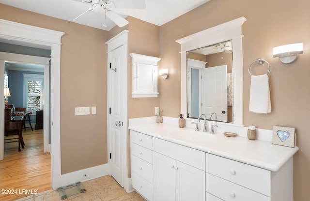 bathroom featuring tile patterned flooring, vanity, and ceiling fan