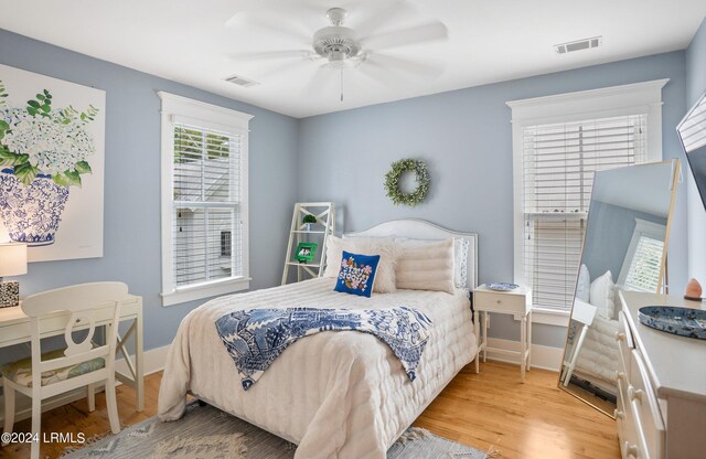 bedroom with light wood-type flooring and ceiling fan