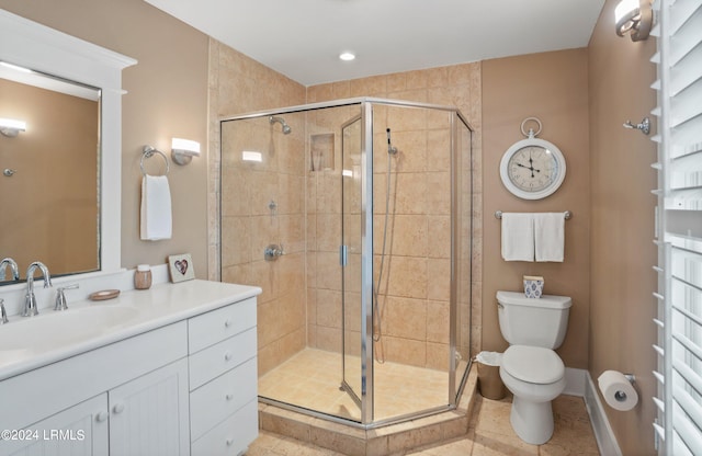 bathroom featuring walk in shower, tile patterned floors, toilet, and vanity