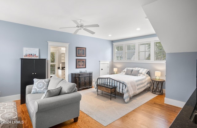 bedroom with ceiling fan and light wood-type flooring