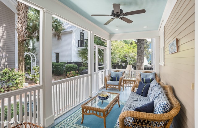 sunroom with a wealth of natural light and ceiling fan