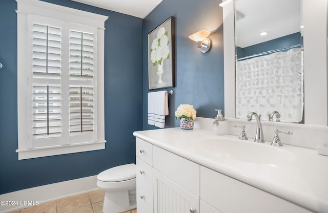 bathroom featuring tile patterned floors, toilet, and vanity