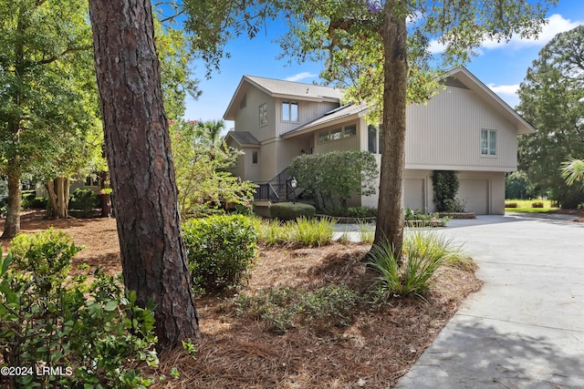 view of property exterior featuring a garage