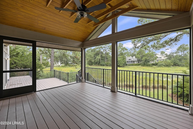 unfurnished sunroom with lofted ceiling and ceiling fan