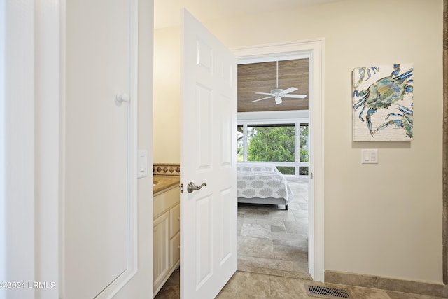 corridor featuring tile patterned flooring