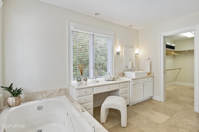 bathroom with vanity and a tub to relax in