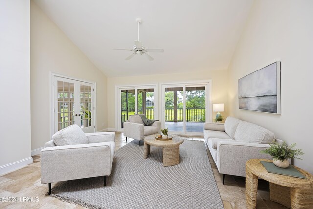 living room with ceiling fan, high vaulted ceiling, and french doors